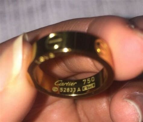 cartier 750 ring 52833a 3 diamonds|cartier love ring real or false.